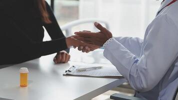 A doctor shaking hands with a patient video