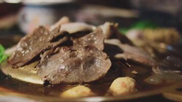 A plate of meat and vegetables on a table video