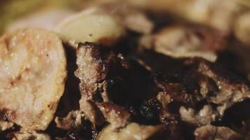 A close up of a plate of meat and potatoes video