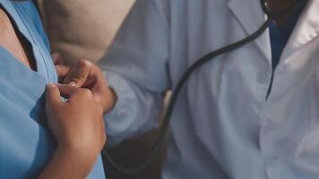 A doctor is checking the heart rate of a woman video