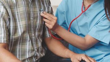 A nurse is checking the heart rate of a patient video