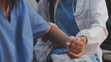 Two nurses shaking hands while sitting in a car video