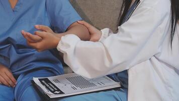 A nurse is holding the hand of a patient video