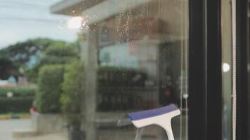A window with a window cleaner on it video
