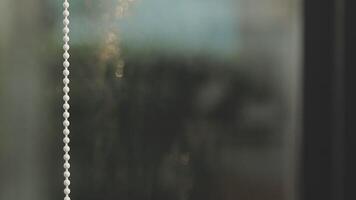A close up of a window with a chain hanging from it video