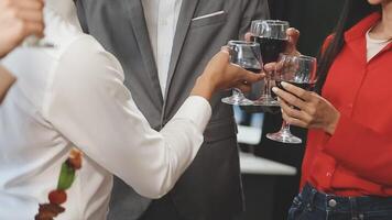 A group of people toasting with wine glasses video