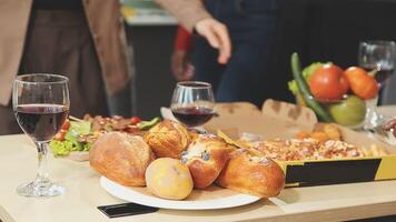 A table with food and wine on it video