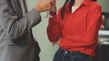 A man and woman toasting with wine glasses video
