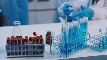 A laboratory with several test tubes and bottles video
