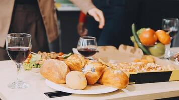 A table with food and wine on it video