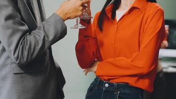 A man and woman toasting with wine glasses video