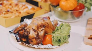 A chicken is sitting on a plate with vegetables video
