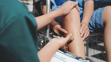 A nurse is examining a patient's leg video