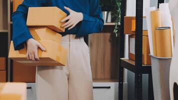 A woman is holding a box of boxes in a room video