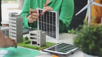 A group of people working on a solar panel video