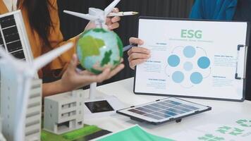 People working on a project with an esg chart video