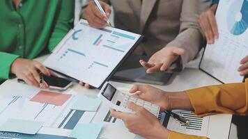 Business people working on a project at a table video