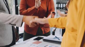 Business people shaking hands at a meeting video