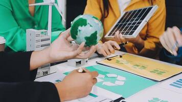 People working on a project with a green globe video