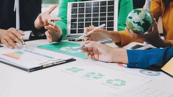 People working on a project with a green globe video