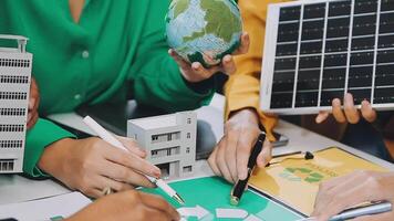 A group of people working on a green project video