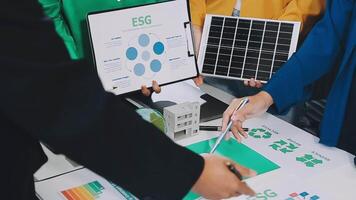 People are holding up a solar panel and a paper with the words egs video