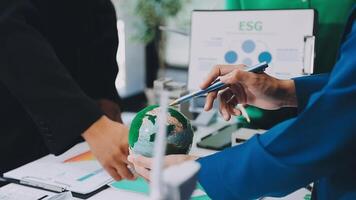 Business people working on a project with a globe video