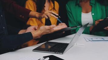 Business people working on laptops at a table video