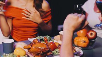A group of people at a table with food and wine video