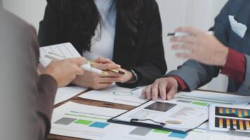 Business people working together at a table video