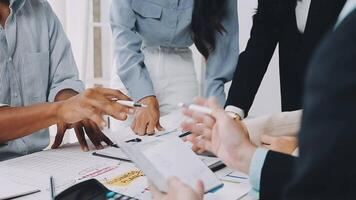 Business people working together at a table video