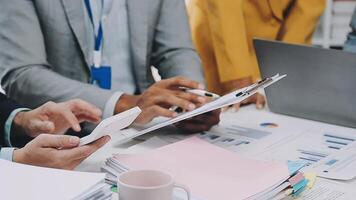 Business people working on paperwork at a desk video