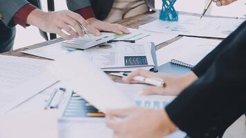 Business people working on paperwork at a desk video