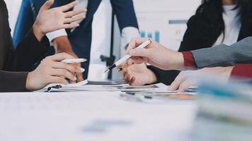 Business people working together at a table video