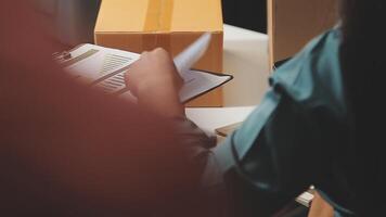 A person is writing on a piece of paper video