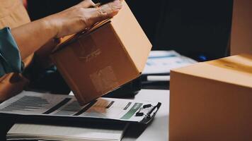 A person is opening a box with a laptop on it video