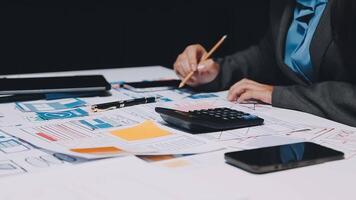 A woman in a business suit is working on a spreadsheet video