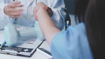 A doctor is shaking hands with a patient video