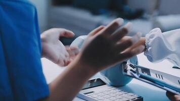 A doctor is holding a tablet while another person is holding a pen video