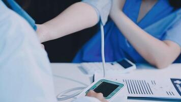 A doctor is checking the blood pressure of a patient video