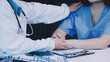 A doctor is examining a patient's wrist video