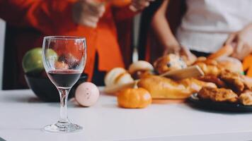 A glass of wine is on a table with food video