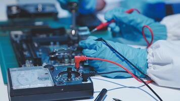 Hands of technicians working on electronic components video