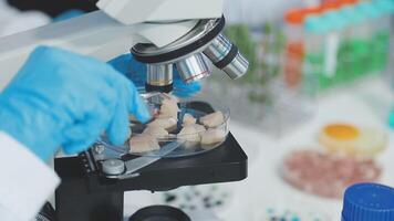 A person in a lab coat is looking at something video