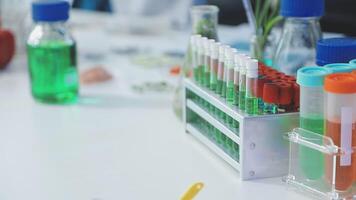 A laboratory table with several test tubes and other items video