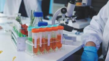 A lab technician is working in a lab video