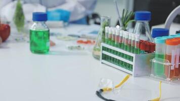 A laboratory table with several test tubes and bottles video