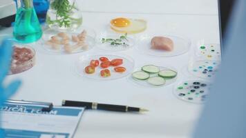 A table with food and a laptop video
