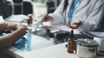 A doctor is talking to a patient at a desk video