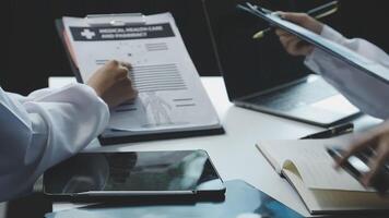 Two doctors are working on a medical document video